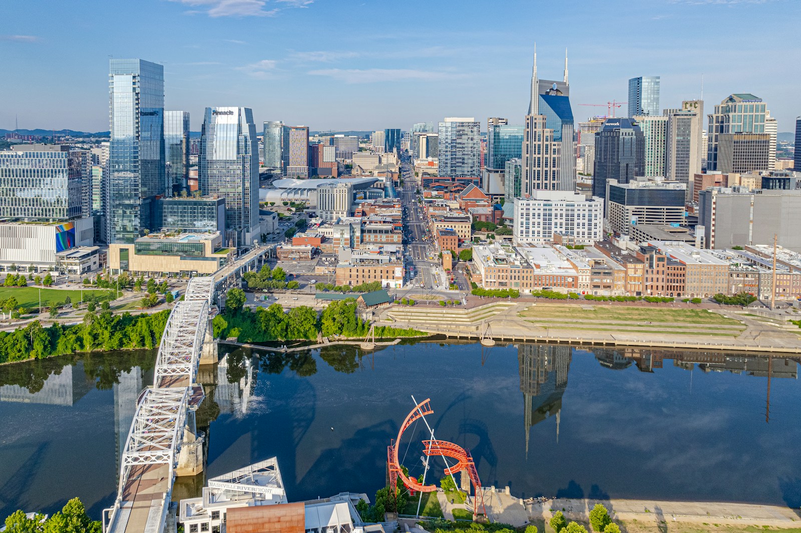 an aerial view of a city with a ferris wheel
